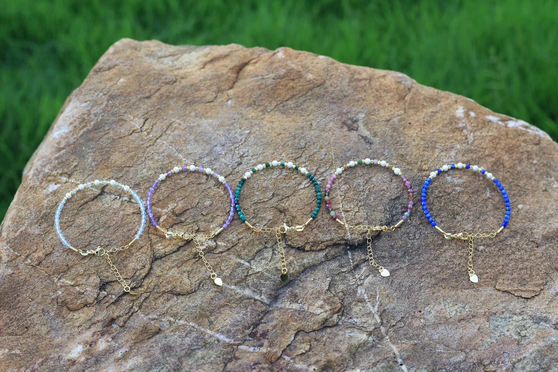 Five Crystal Houzz adjustable gemstone bracelets with mother-of-pearl shell accents in blue topaz, amethyst, malachite, tourmaline, and lapis lazuli